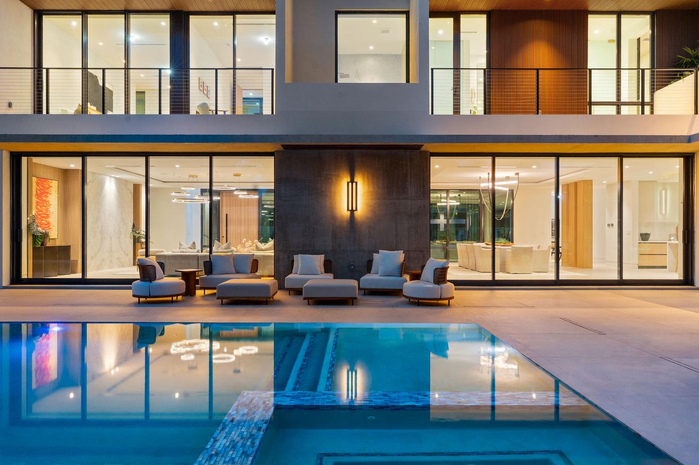 Twilight pool and rear glass wall